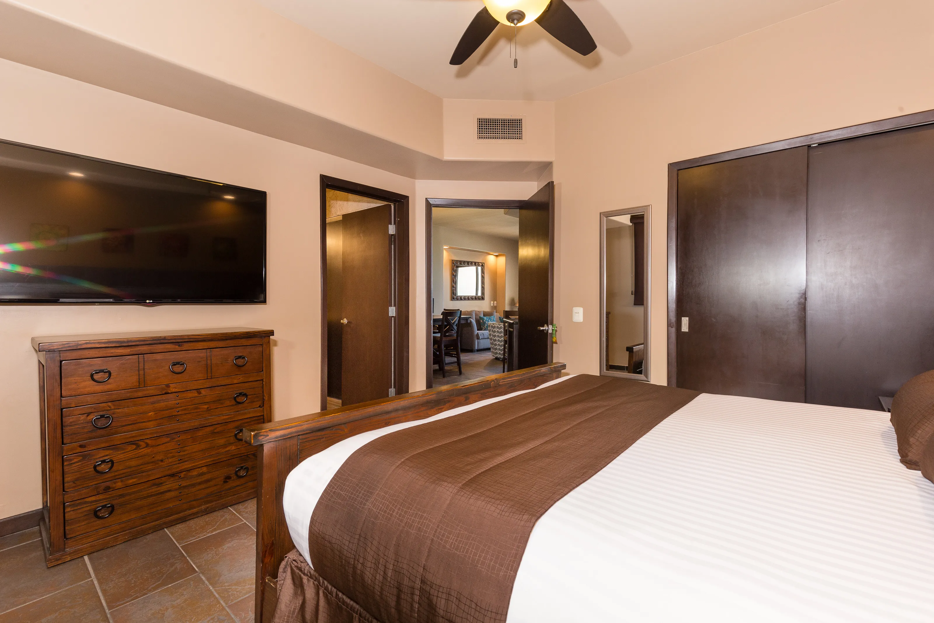 Cozy bedroom with brown and beige tones and modern decor.