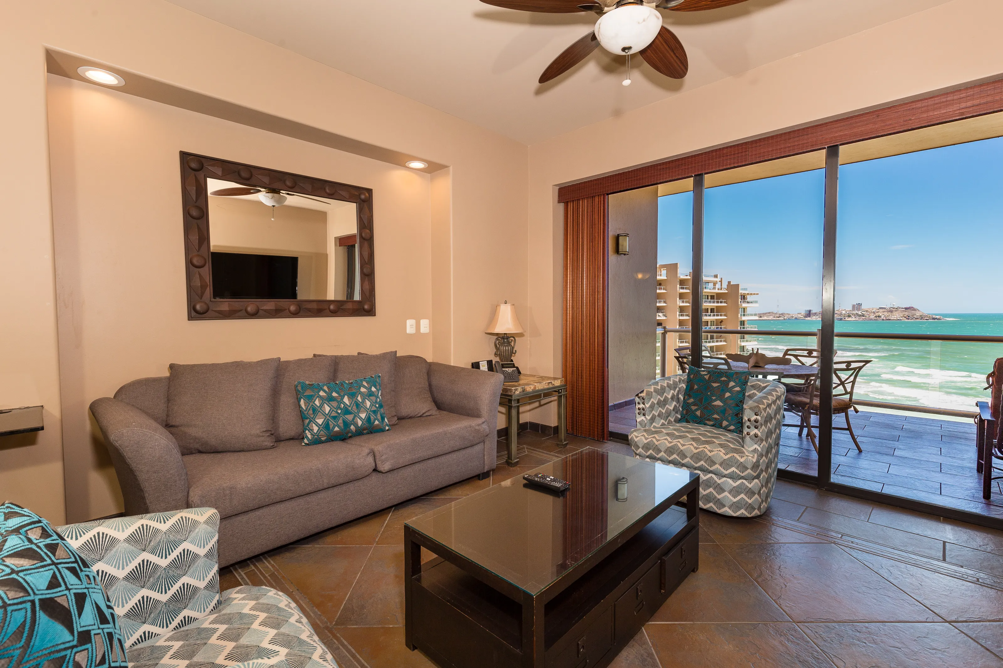Cozy living room with ocean view and modern decor.